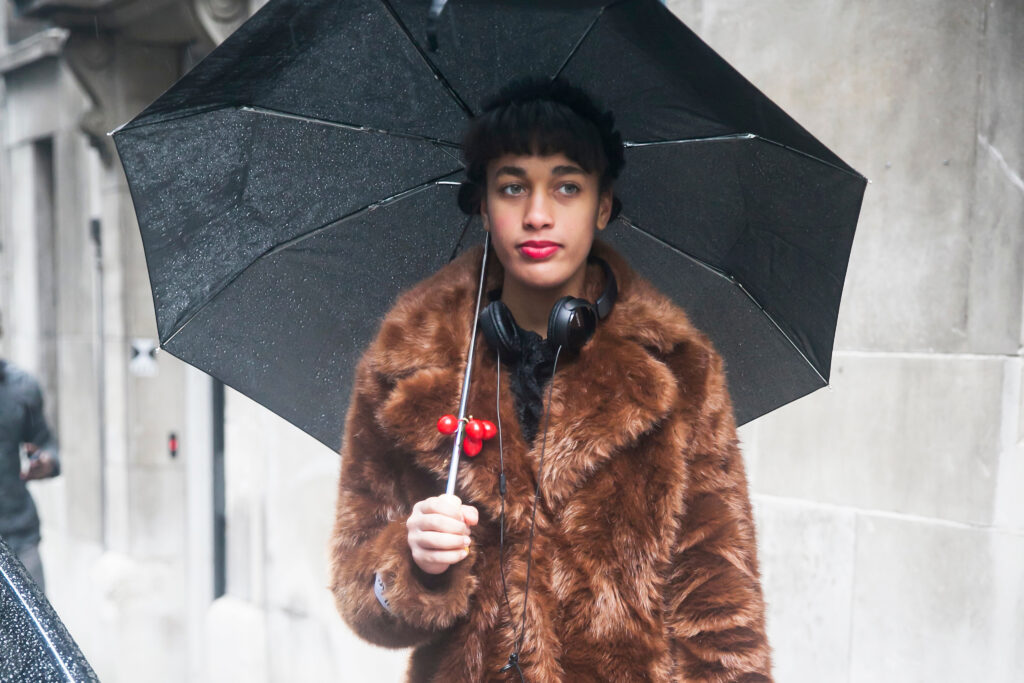 Best luxury rain gear fashion essentials for rainy day style, boots, jacket and coat, to be chic in the spring showers this April 2021.