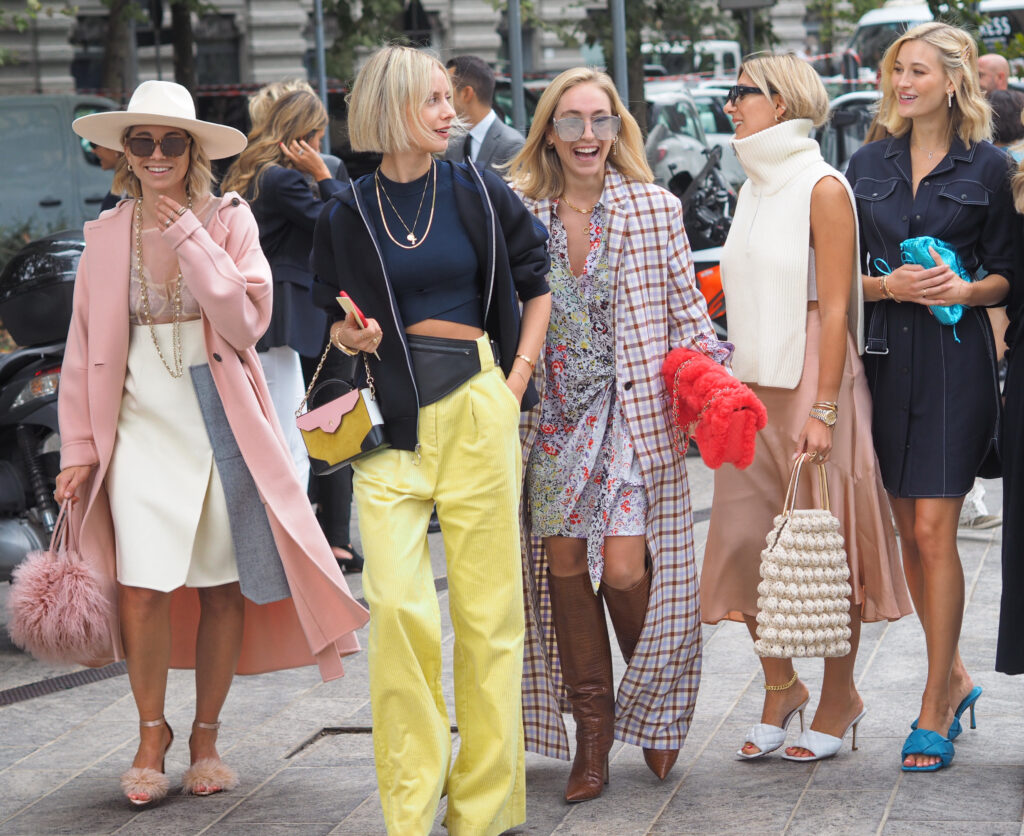 examples of dopamine dressing, the bright color trend in luxury designer fashion outfits and accessories for fall 2021 as seen during Copenhagen Fashion Week.