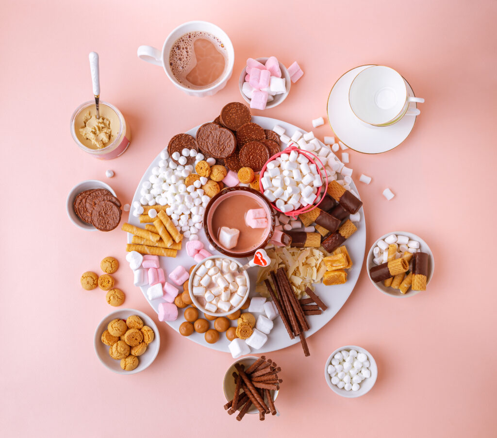 ideas and the best ingredients to buy for a haute hot cocoa dessert charcuterie board this winter, including premium chocolate, gourmet marshmallows and more.