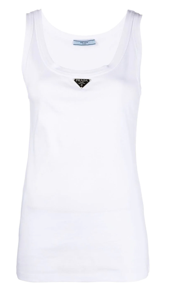 Best luxury designer white tank tops for women to channel the big fashion trend of summer 2023, including Balmain, Saint Laurent and more.