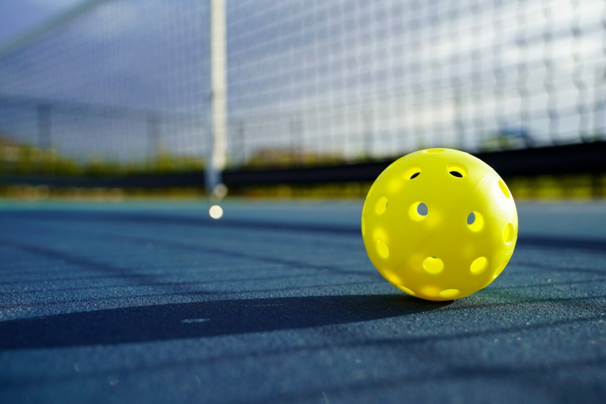 why the latest cool outdoor sport to love is Pickleball and what you need to know and buy to get started in summer 2022.
