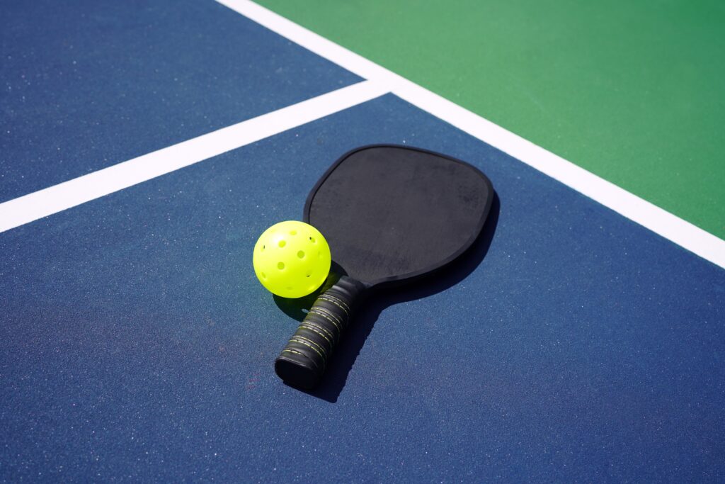 why the latest cool outdoor sport to love is Pickleball and what you need to know and buy to get started in summer 2022.