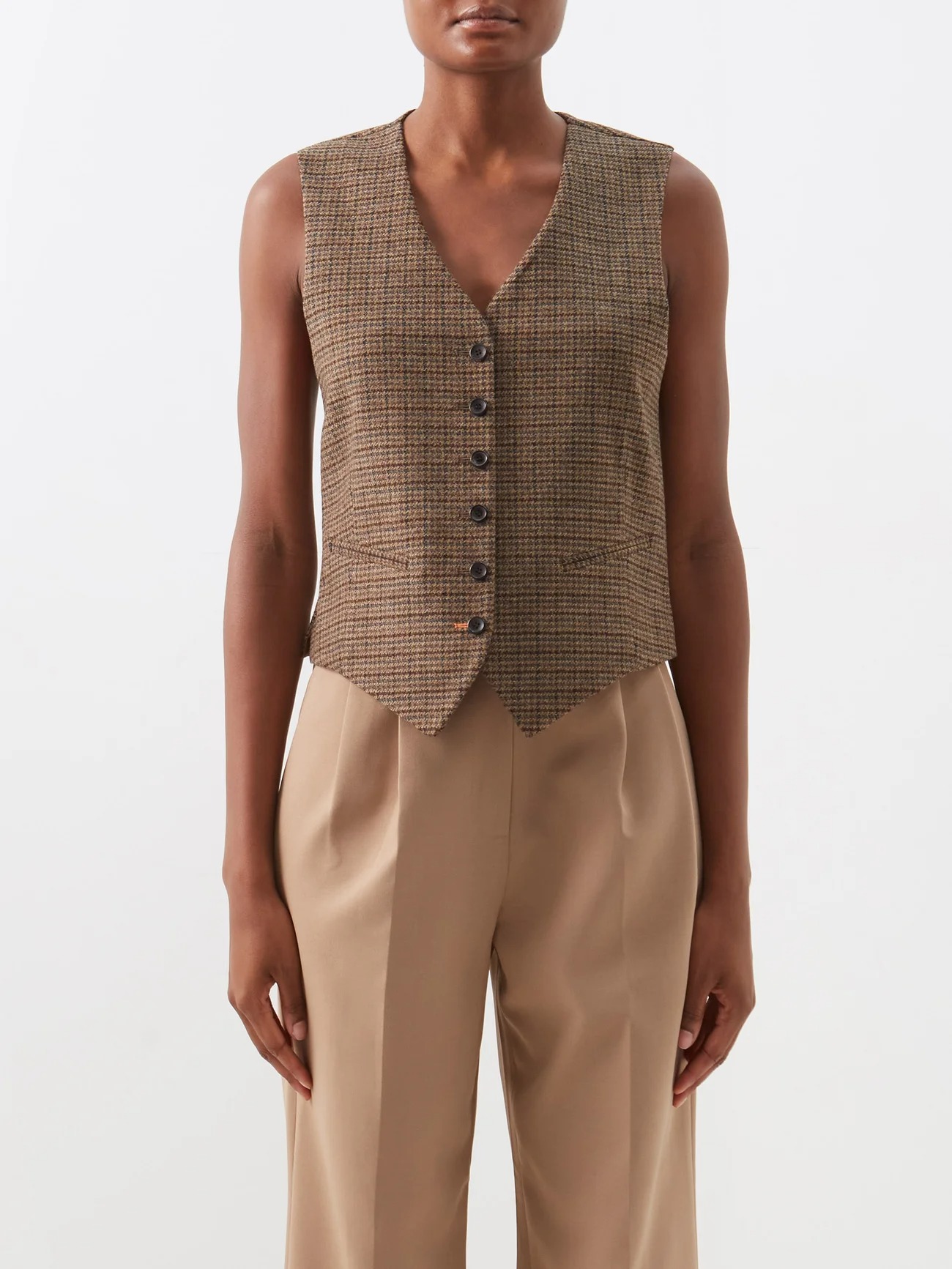 Suit vests and waistcoats for women from luxury designers, including boxy and classic cuts, and fashion versions in linen and corduroy.