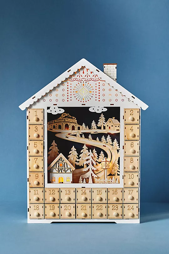 Best items in the adorable new home collection from Anthropologie for Christmas holiday 2022, including pillows, stockings, candles and more.