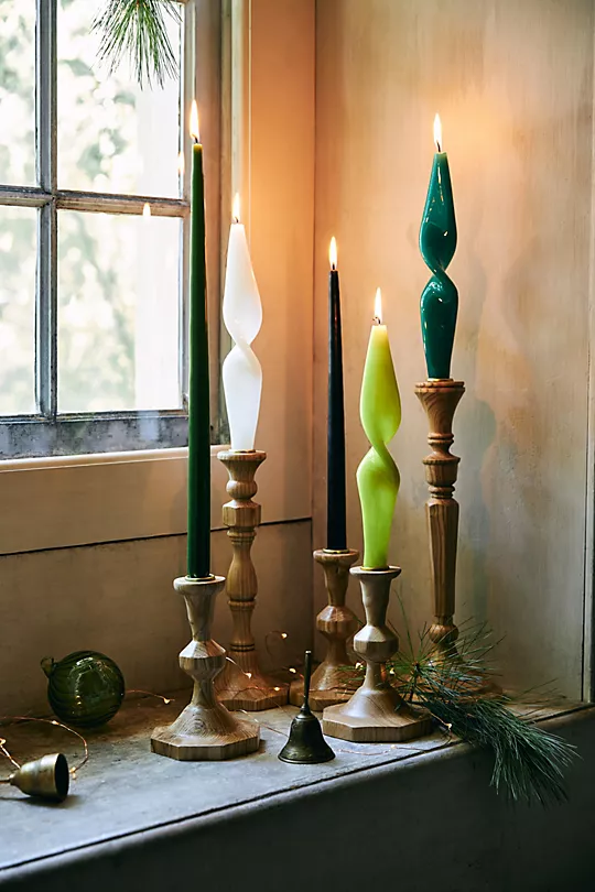 Best items in the adorable new home collection from Anthropologie for Christmas holiday 2022, including pillows, stockings, candles and more.
