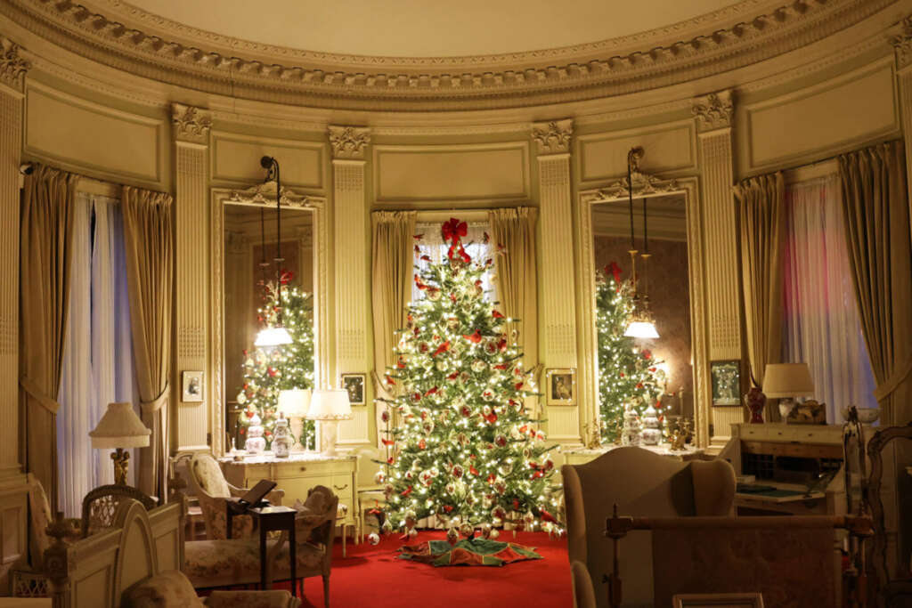 A Christmas holiday tour with our best photos of the Breakers mansion in Newport, Rhode Island decorated with lights and trees inside and out.