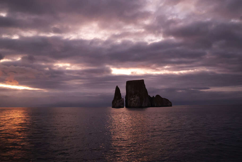 photos of Kicker Rock in the Galapagos Islands at sunset.