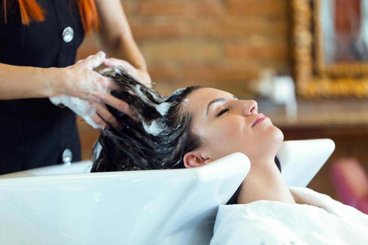 Expert tips from luxury salon styles on how to strengthen and repair damaged hair, including serums, shampoos, conditioners, and hair masks. 