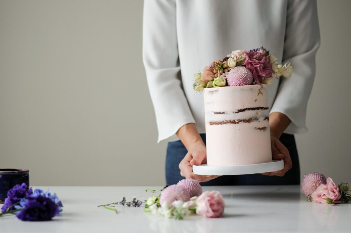 The top new trends that bakers, brides and grooms are using to elevate traditional wedding cake, including design, decoration and flavors.