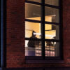 Twilight cityscape photograph by Pamela Thomas-Graham featuring indigo skies and golden windowlight, exclusive featured image for The Reading Room: Timeless Books November 2025.