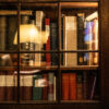 Twilight still life of books, candles, and reading accessories photographed by Pamela Thomas-Graham for Dandelion Chandelier’s Paper, Light, and Time: Luxury Holiday Gifts for Readers 2025.