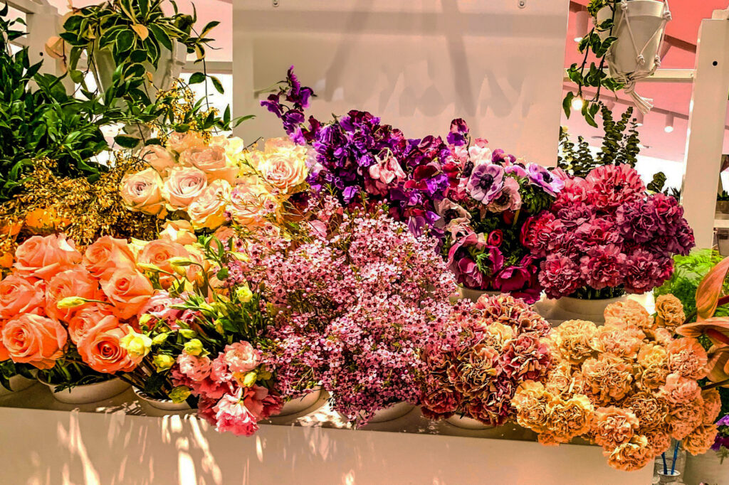 Overfilled florist display illustrating shock and awe excess in luxury gift etiquette.