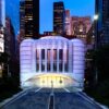 Saint Nicholas Greek Orthodox Church and National Shrine glowing at twilight in Lower Manhattan.