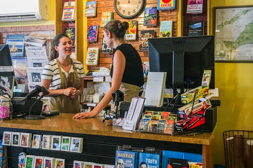 Booksellers at the counter inside Bunch of Grapes bookstore on Martha’s Vineyard.