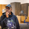 Artist Derrick Adams in his Crown Heights Brooklyn studio during a Dandelion Chandelier studio visit.
