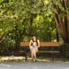 Woman reading a book on a bench in a leafy garden in Athens, lead image for Fresh Ink May 2026 on Dandelion Chandelier