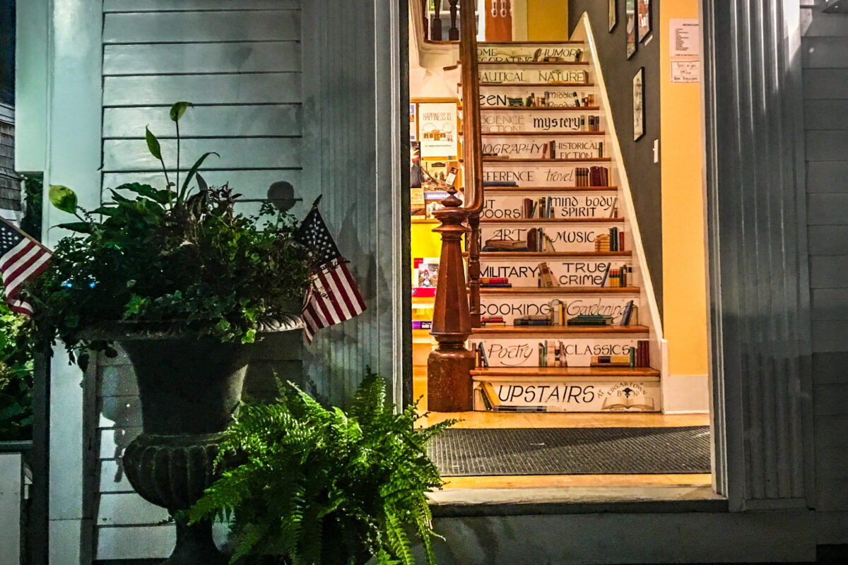 Entrance to Edgartown Books on Martha’s Vineyard with the painted bookstore staircase visible inside.