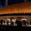 Crowd outside the Delacorte Theater at night during Shakespeare in the Park in Central Park, New York.