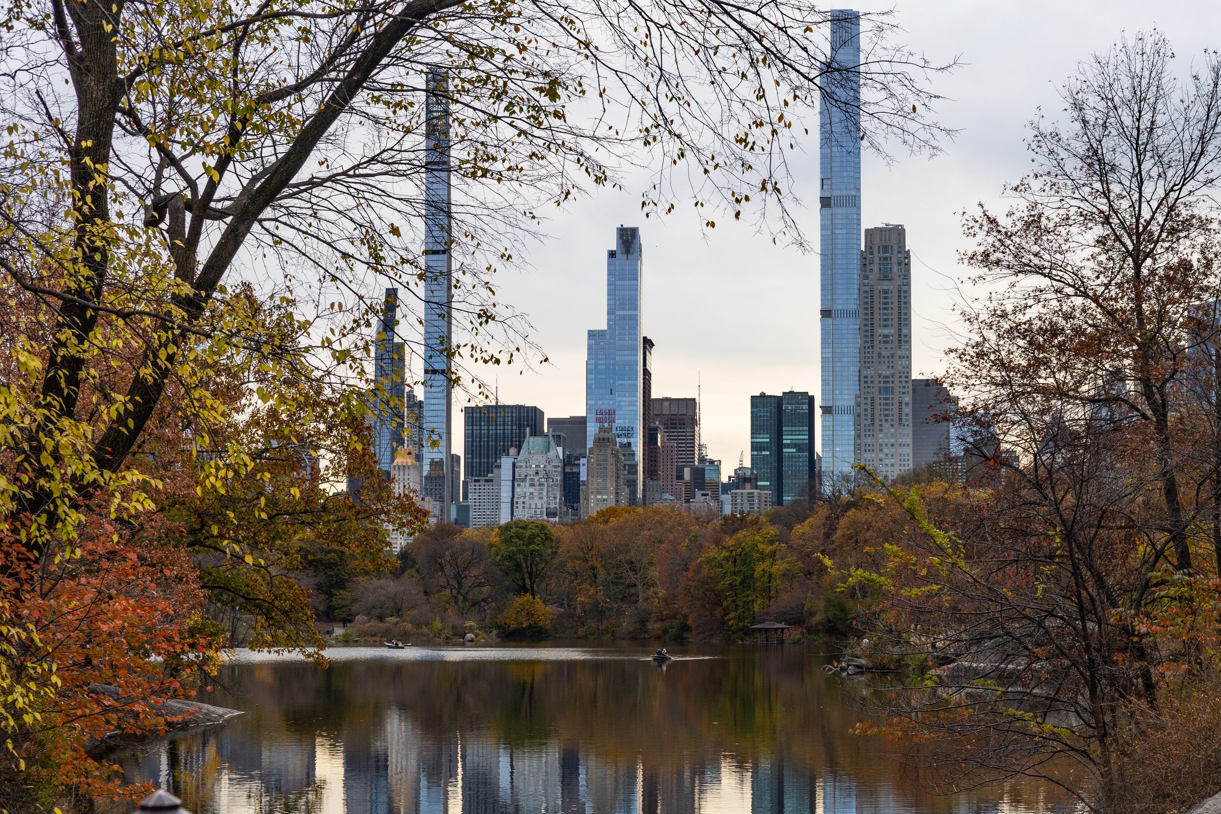 Central Park lake and Manhattan skyline framed by autumn foliage for Dandelion Chandelier's Fall guide.