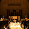 String quartet performing by candlelight in a New York church during Halloween season, photographed by Pamela Thomas-Graham.