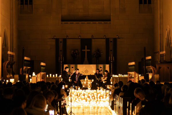 String quartet performing by candlelight in a New York church during Halloween season, photographed by Pamela Thomas-Graham.