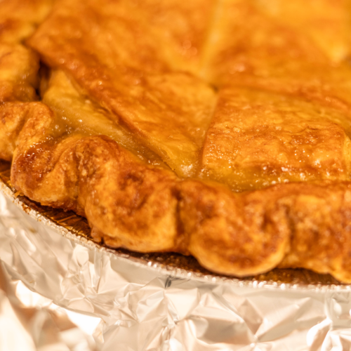 Close-up of the golden flaky crust on Four & Twenty Blackbirds Salted Caramel Apple Pie during Dandelion Chandelier’s mail-order apple pie tasting.
